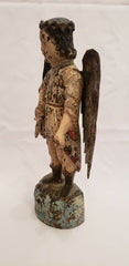 Wood carved angel with tin wings