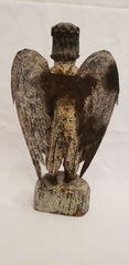 Wood carved angel with tin wings