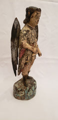 Wood carved angel with tin wings