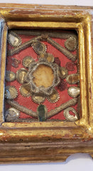 Small reliquary on golden frame