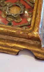 Small reliquary on golden frame