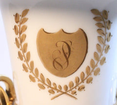 Set of two white and gold porcelain urn vases