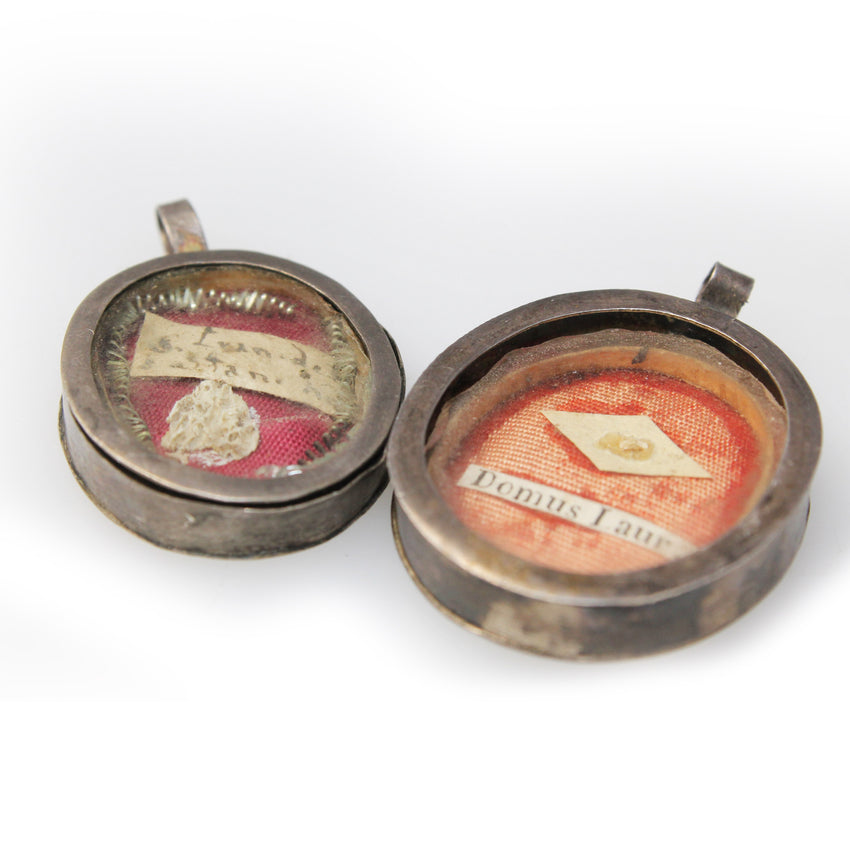 Antique Reliquaries on laid on red velvet and in Tin containers